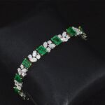 Gouden armband met diamanten en smaragden