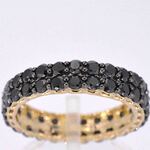 Gouden eternity ring met zwarte diamanten