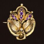 Gouden broche met amethist
