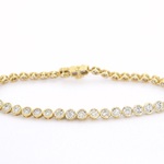 Gouden armband vol met diamanten gezet
