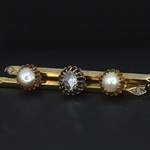 Gouden broche met diamant en parels