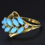 Gouden ring met diamant en blauwe edelsteen