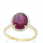 Gouden entourage ring met diamanten en robijn