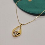 Pierre Balmain goldplated pendant collier met parel en steentjes