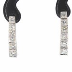 Witgouden riviera oorbellen met natuurlijke diamant