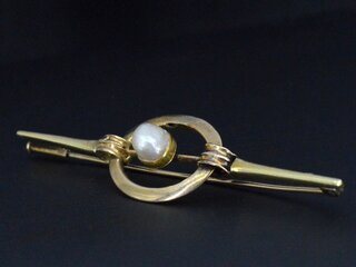 Gouden broche met orient parel