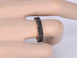 Gouden dubbele eternity ring met zwarte diamanten