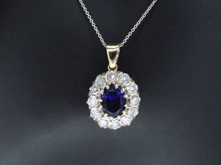 Gouden hanger met een blauwe edelsteen en natuurlijke witte diamanten