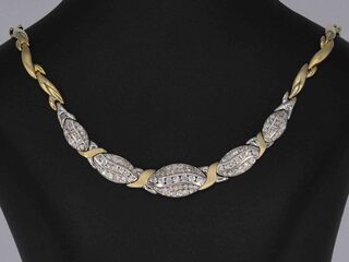 Gouden ketting met witgouden schakels