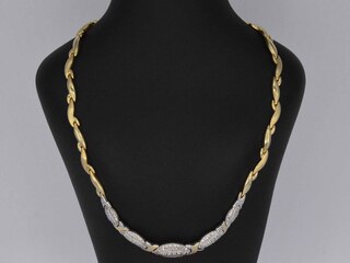 Gouden ketting met witgouden schakels