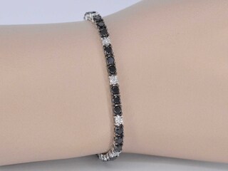 Witgouden tennisarmband rondom gezet met zwarte en witte diamanten