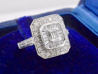 Gouden design ring gezet met briljant en baguette geslepen diamanten