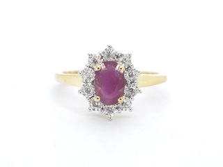 Gouden entourage ring met robijn en diamanten