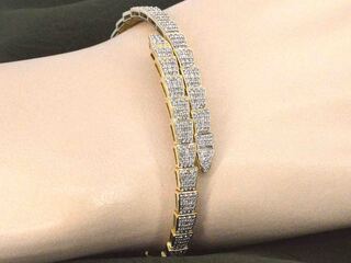 Gouden armband van serpent model met natuurlijke diamanten