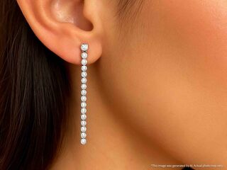 Witgouden oorhangers met een rij aan natuurlijke diamanten