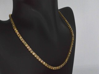 Geelgouden exclusieve tennis collier met champagne en cognac diamanten