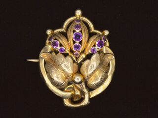 Gouden broche met amethist