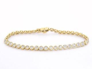 Gouden armband vol met diamanten gezet