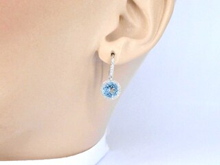 Witgouden entourage oorbellen met grote topazen en diamanten