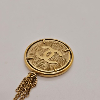 Chanel CC collier 24kt goldplated sunburst medallion pendant