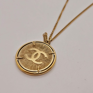 Chanel CC collier 24kt goldplated sunburst medallion pendant